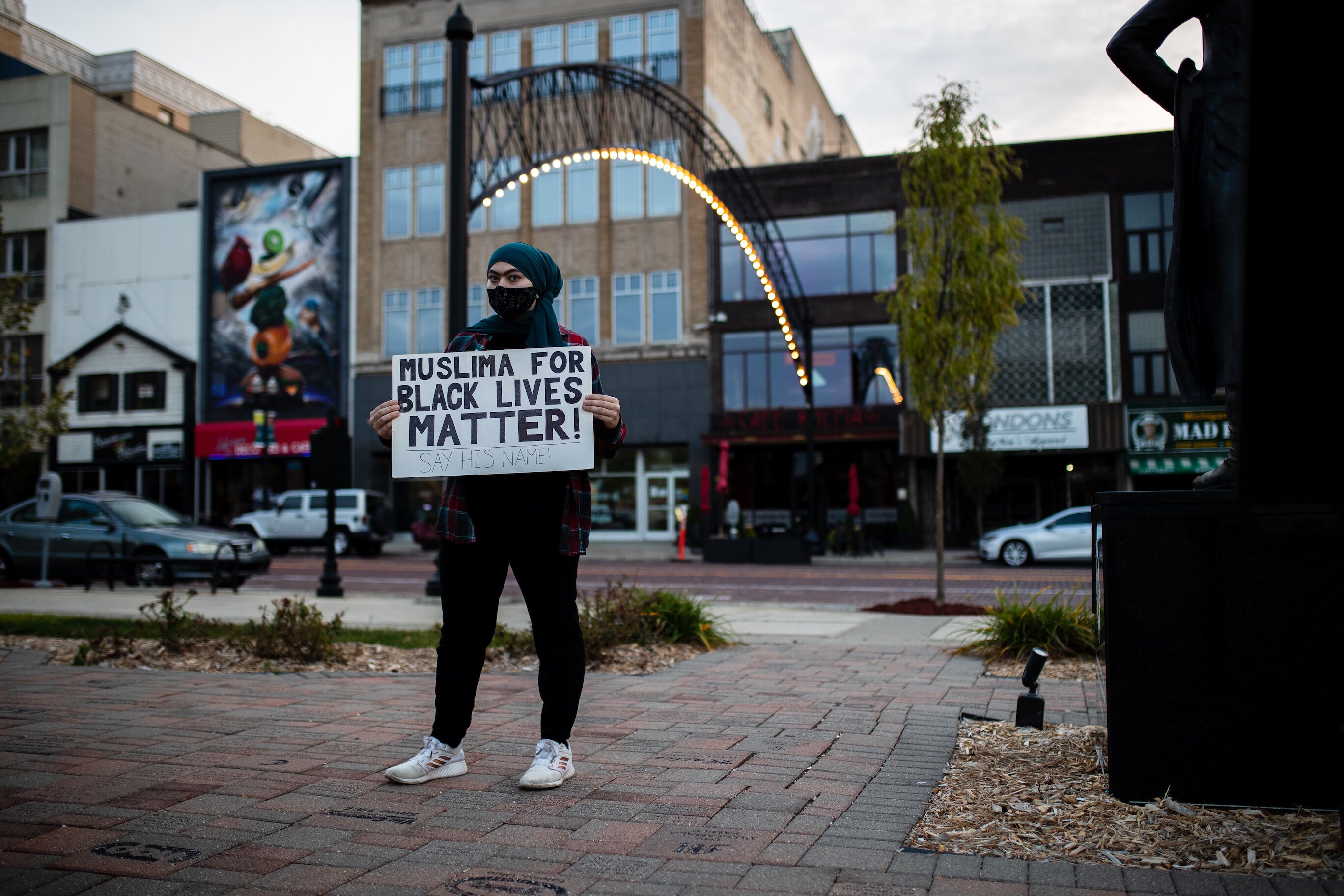 Dana Sanchez, 23, a senior at the University of Michigan-Flint, stands with her sign, “Muslims for Black Lives Matter! Say His Name!”