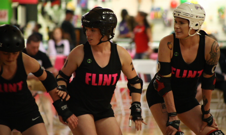 Sydney McCarley, aka Slim Fast; Veronica VanCleve, aka Van Cleaver; and Grace Seymore, aka Graced Lightning, (left to right) get ready for the start of a jam.