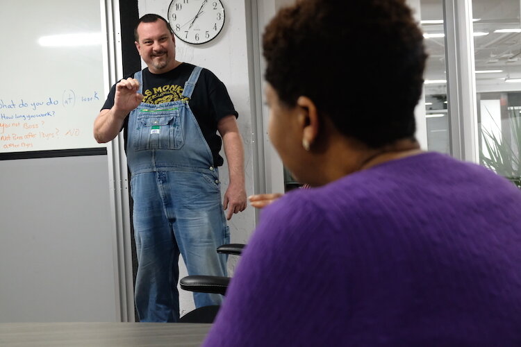 Co-teacher Brian Whittington graduated from Michigan School for the Deaf and Blind in 1985 and volunteers to help teach Linda Bell's ASL classes.