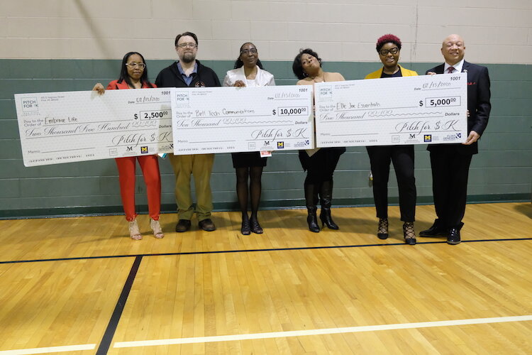 The top three winners posing with their checks after the Pitch for $K event.