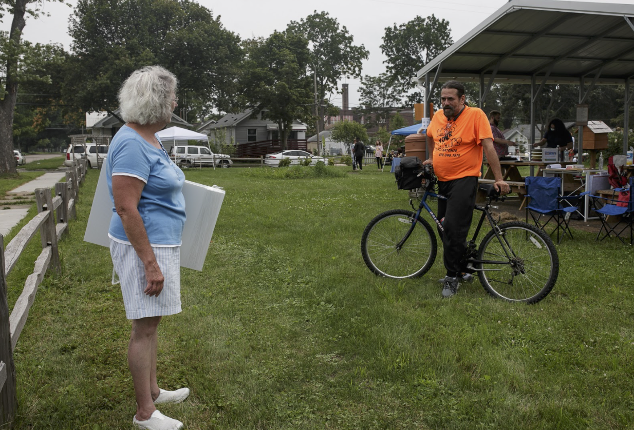 Edna Sabucco talks with a neighbor during Eastside Franklin Park's craft fair July 24.