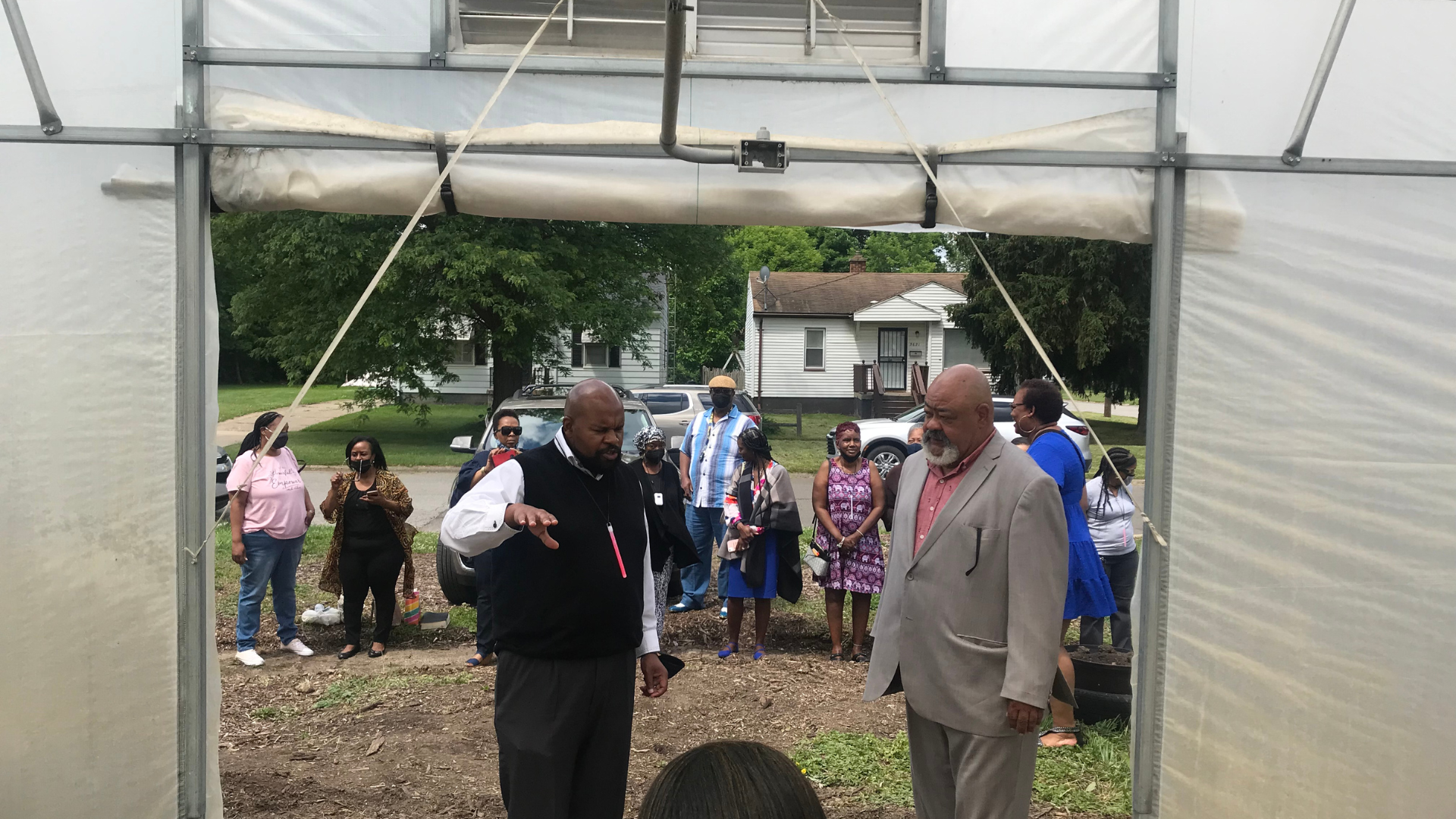 Pastor Overton stands blessing EJ's Garden for generations to come.