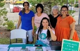 Jennifer Johnson, founder of Elations Health, with volunteers who helped provide free smoothies and childrens' activities at the health and wellness fair.