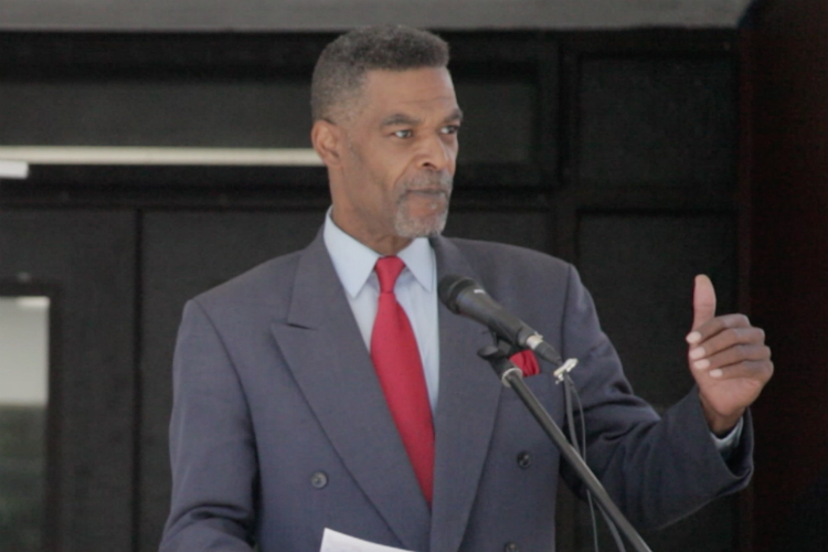 Flint City Councilman Eric Mays addresses the crowd during the ribbon-cutting ceremony for Flint Development Center on Thursday, June 8, 2017. 