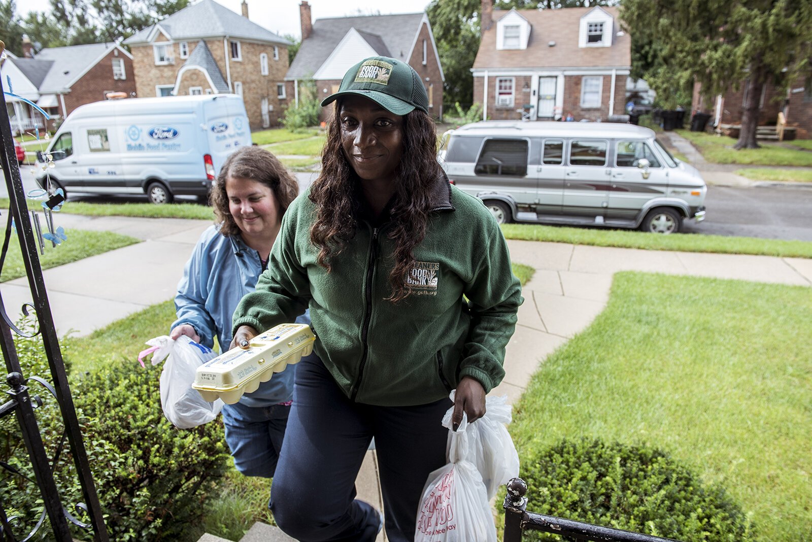 Staff make a delivery of healthy food to a Henry's Groceries participant.