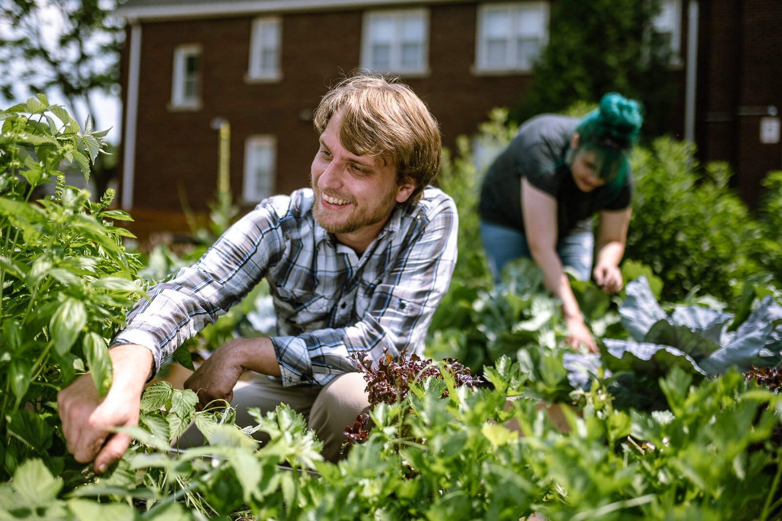 John Peterson and Lauren Potorek in AIHFS' garden.