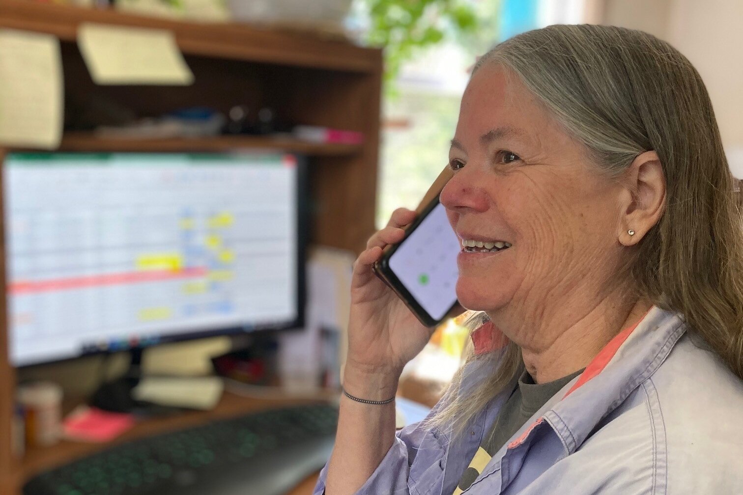 Tri-County Office on Aging volunteer Robin Barfoot makes a friendly reassurance call from her home.