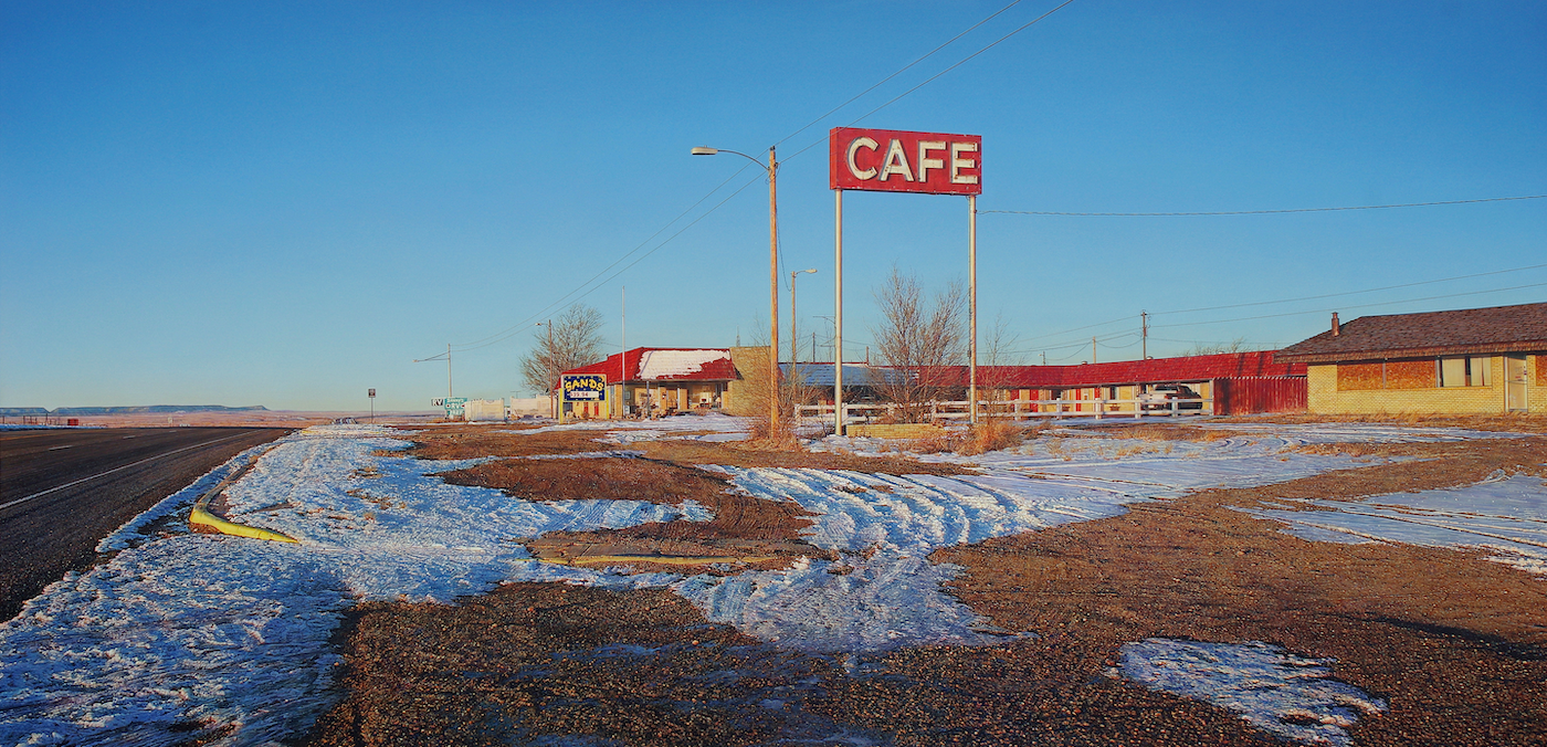 Rod Penner, American, b. Canada, 1965. Sands Motel & Café, 2019. Acrylic on canvas, 31 x 64 in. Collection of Louis K. and Susan P. Meisel.