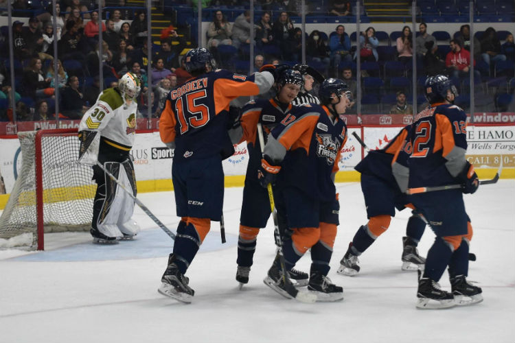 Flint Firebirds players celebrate after a goal.