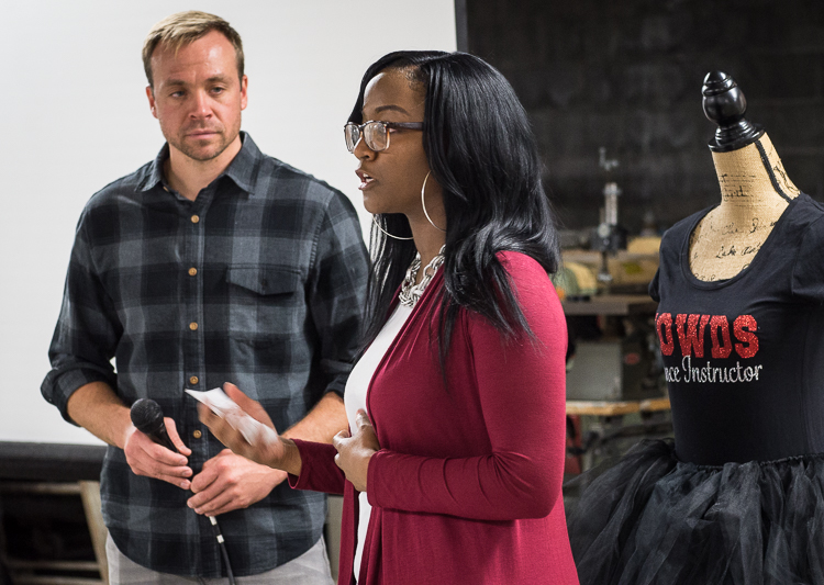 Porcha Clemons receives her microgrant at the Flint SOUP October event at Factory Two in Flint. She won more than $1,300. At left is Flint SOUP co-leader James Shuttleworth.