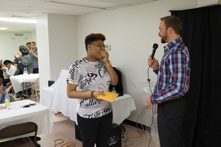 Talicia Campbell, owner of Chef Telly, receives the microgrant from Flint SOUP co-leader James Shurttleworth at the January event.