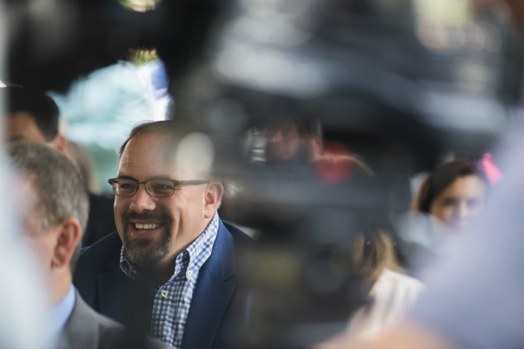 State Sen. Jim Ananich shares a laugh with the crowd during a groundbreaking ceremony at the Flint Cultural Center Academy Tuesday, June 26, 2018 in downtown Flint. The new public, nonprofit charter school will serve students in grades K-8. 