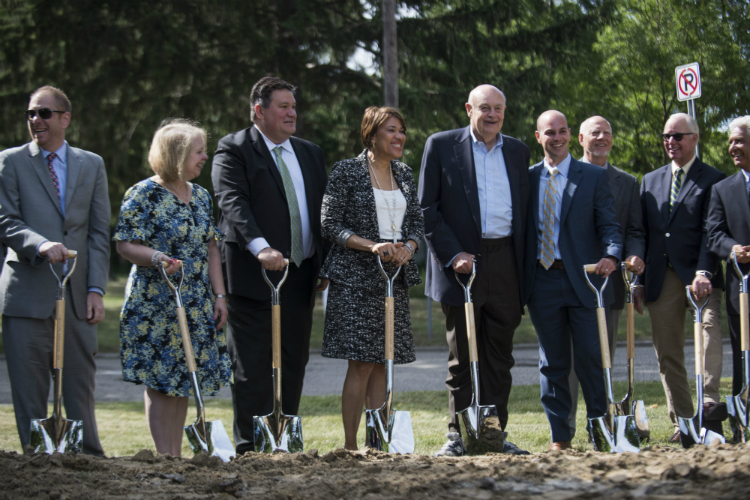 Officials line up in preparation for the ceremonial groundbreaking for the Flint Cultural Center Corporation on Tuesday, June 26, 2018.