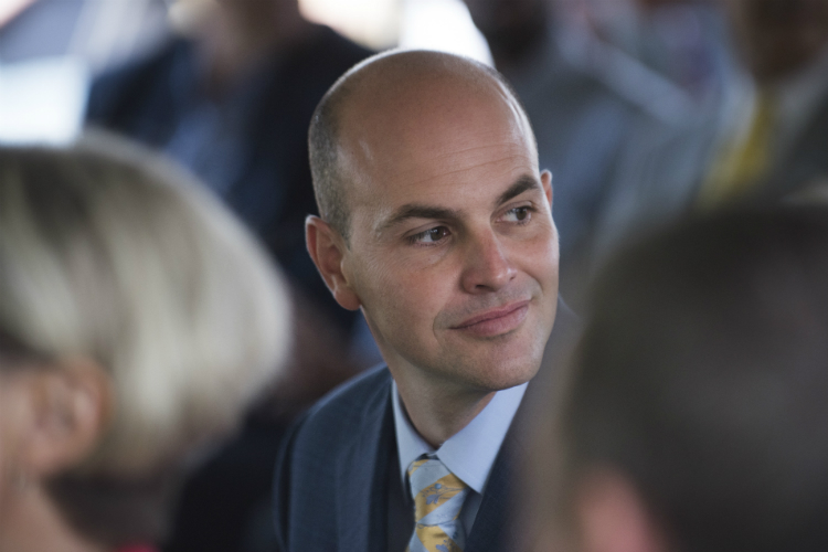 Charles Stewart Mott Foundation President Ridgway White looks through the crowd during a groundbreaking ceremony at the Flint Cultural Center Academy.