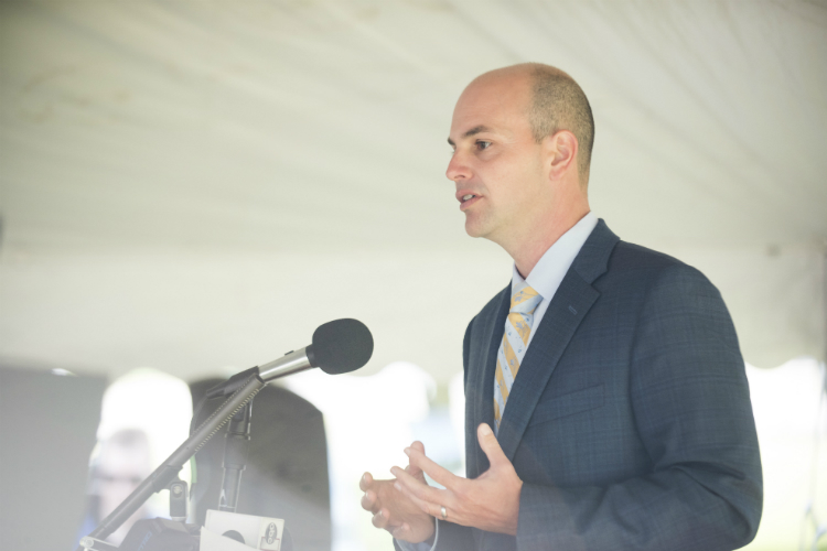 Charles Stewart Mott Foundation president Ridgway White speaks to the crowd at the official construction kickoff for the Flint Cultural Center Academy. 