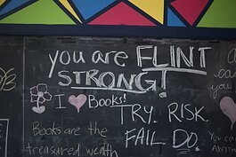 Positive messages are written on a chalkboard in a classroom at the Sylvester Broome Empowerment Village.