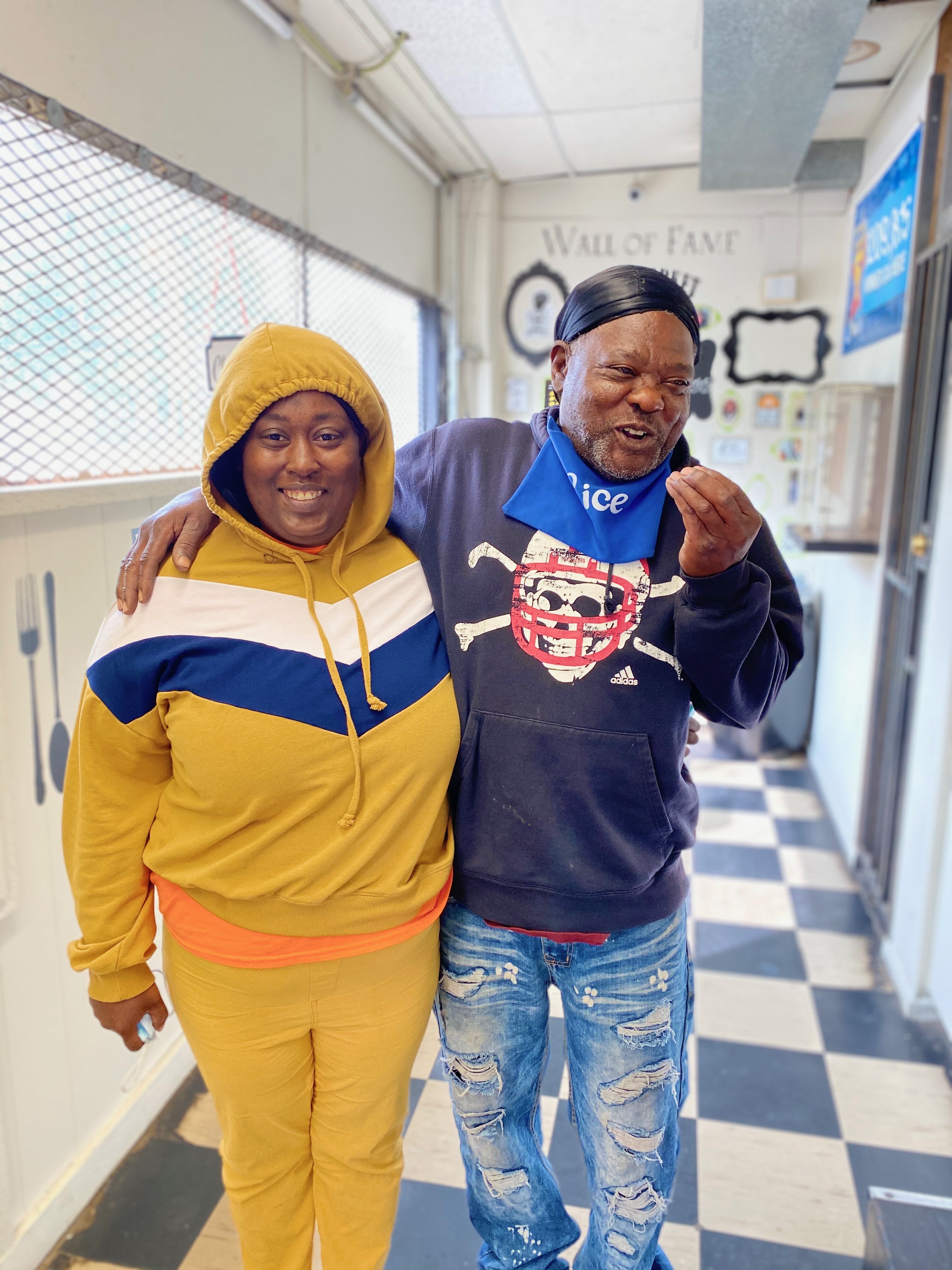 Customers Fred Rice and Kelly Lynn are all smiles while waiting on the famous tacos.