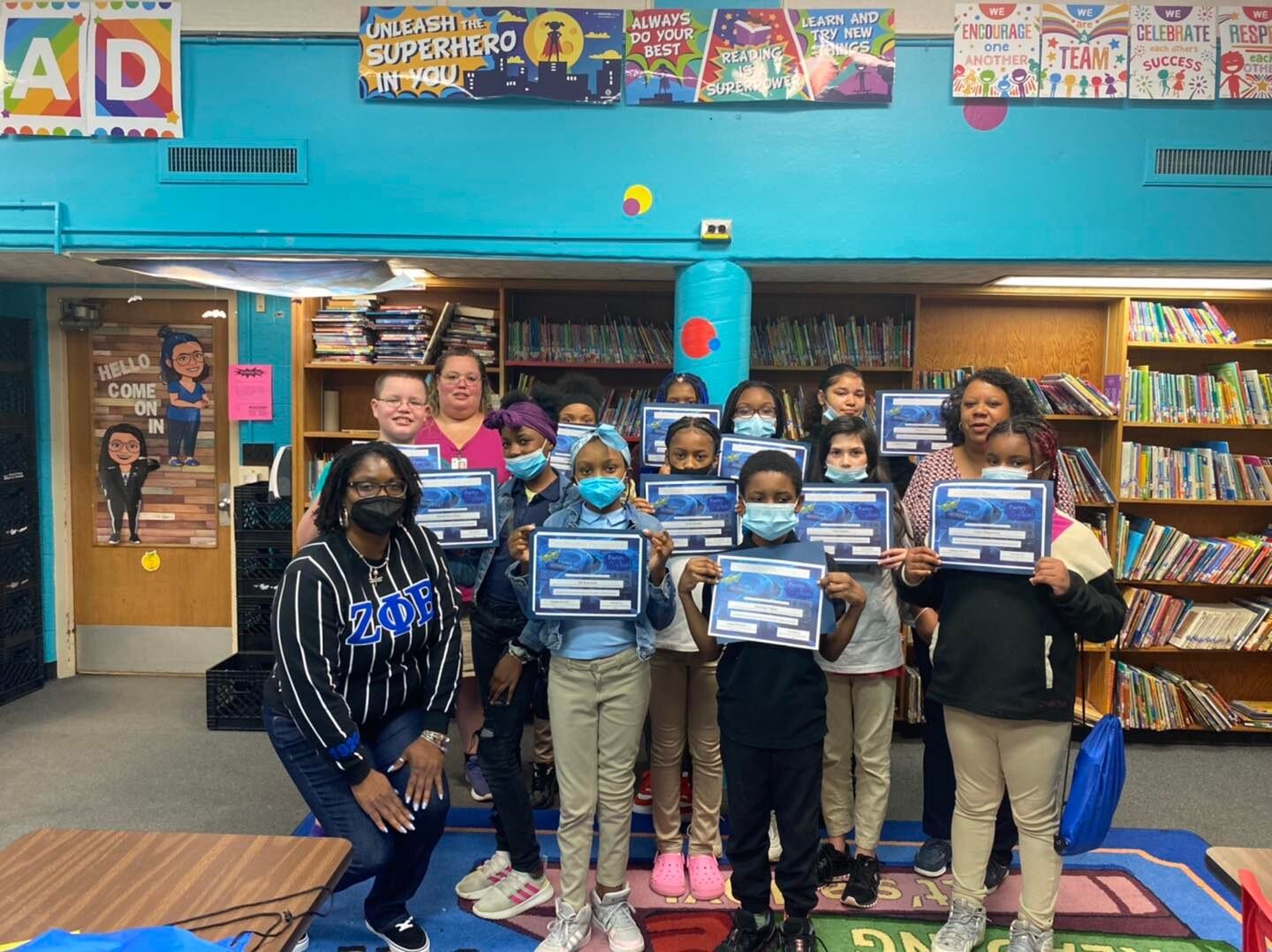 Freeman Elementary's Freeman Poets and Flint Poet Laureate Semaj Brown during the 'Poetry Paints: Ekphrastic Writing' event. 