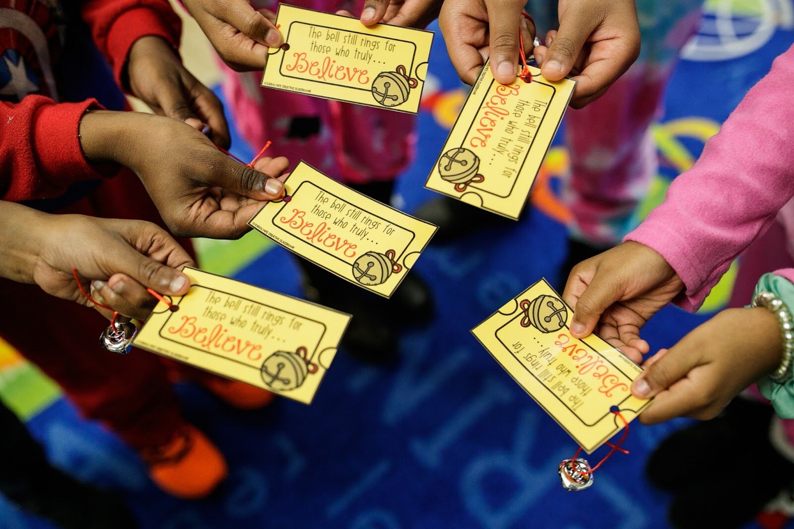 Third-grade Freeman scholars hold their golden ticket for The Polar Express during Freeman Elementary’s holiday celebration of literacy and reading comprehension on Friday, Dec. 16, 2022.