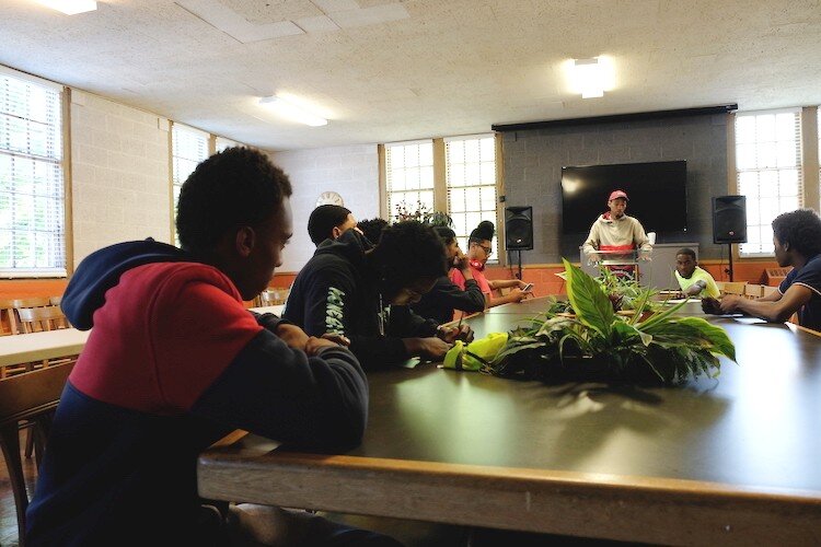 The Flint Grounds Crew at their daily 9 a.m. meeting on the main floor of Joy Tabernacle Church.