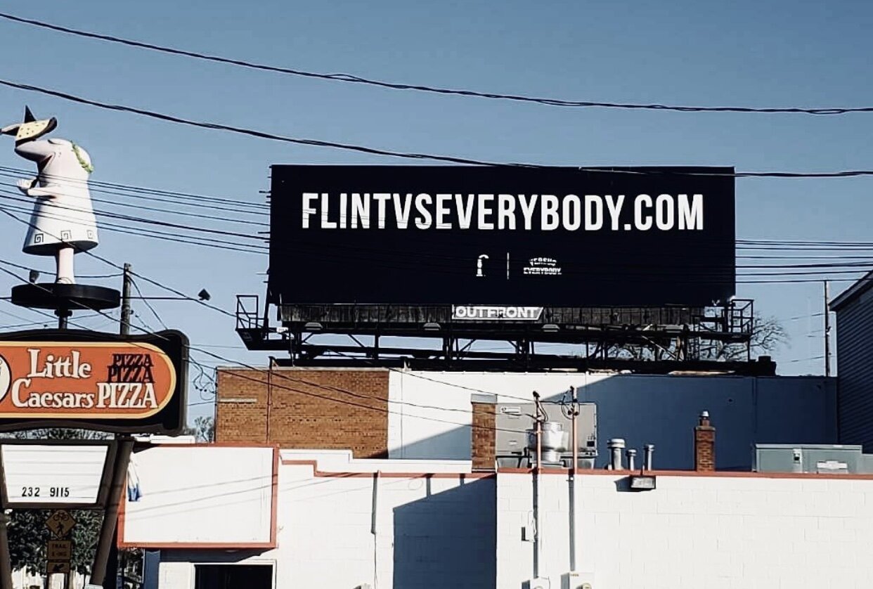 A FLINT VS EVERYBODY billboard on Ballenger Highway.