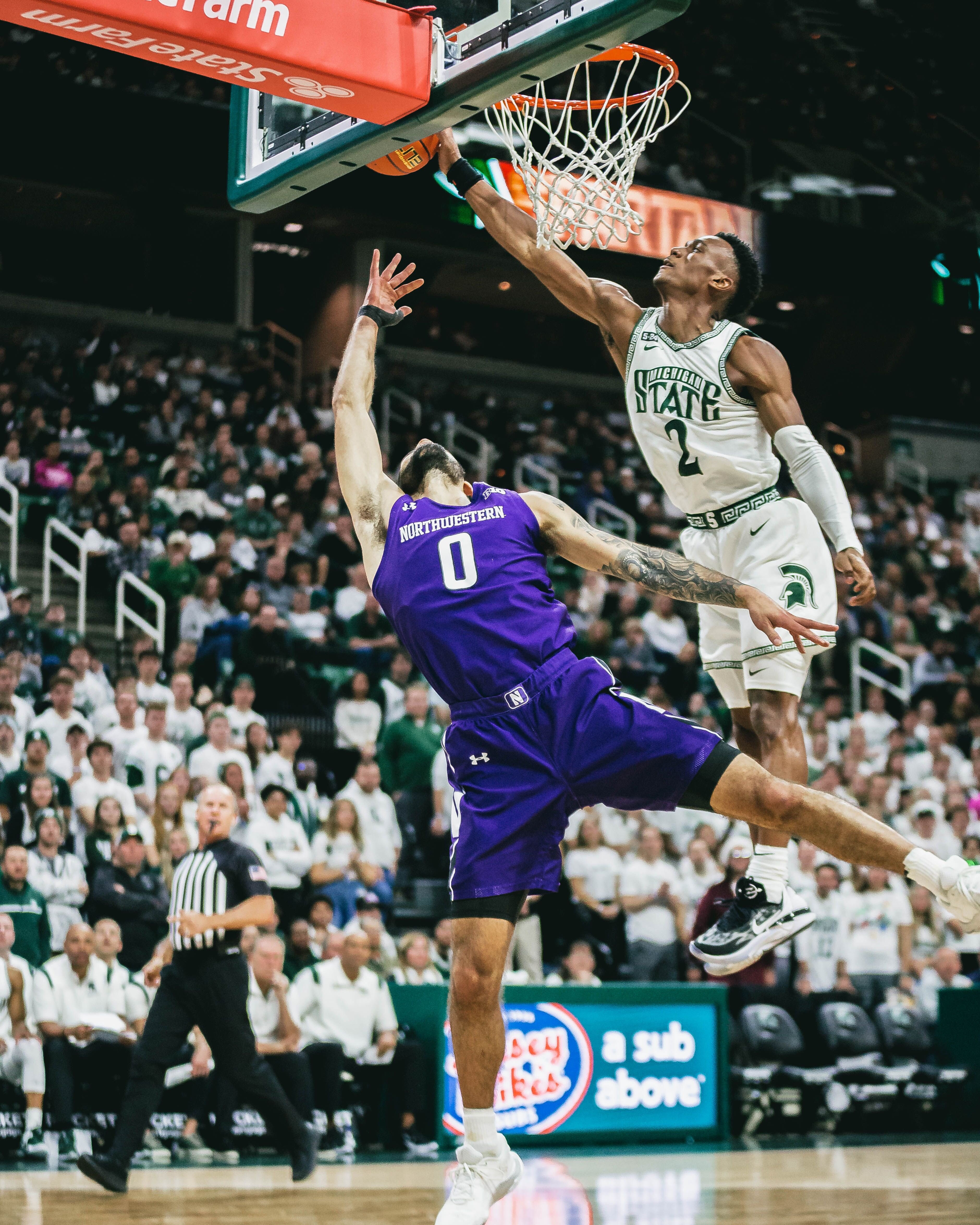 Michigan State's Tyson Walker takes it straight to the hoop during Sunday's game.