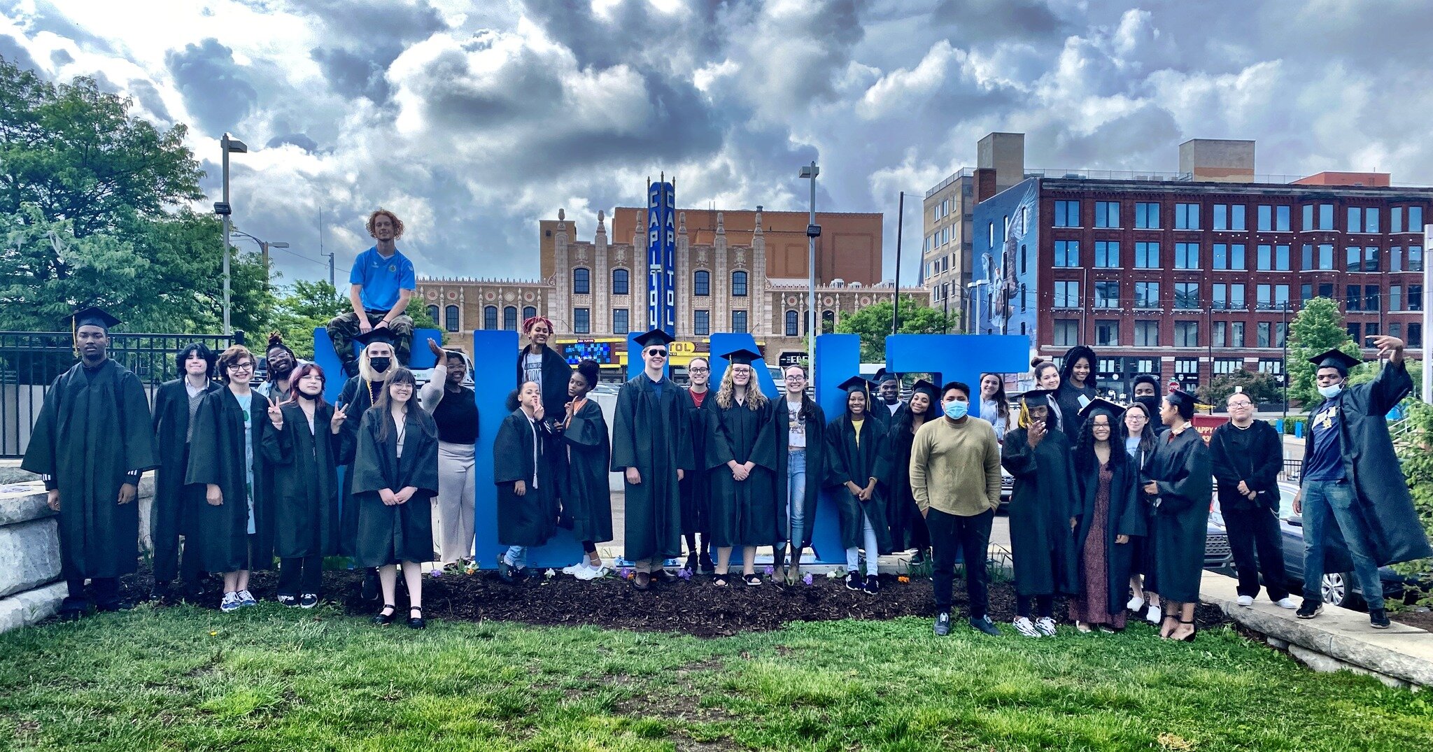 Genesee Early College's class of '22 graduates snap a group photo after their ceremony at The Capitol Theatre in Flint on June 9, 2022.