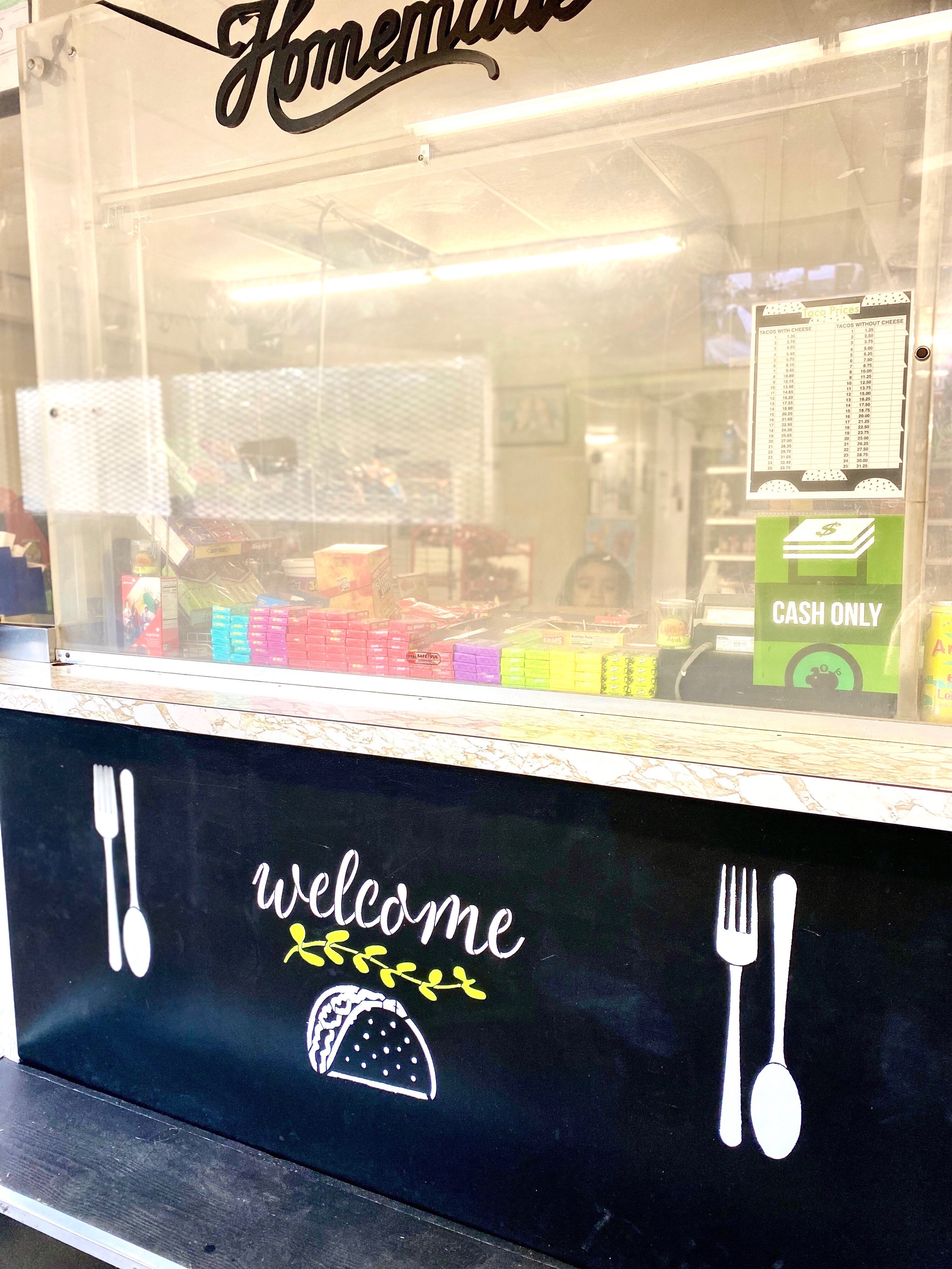 The front counter at A&G Market is behind glass that was salvaged from a bank that had closed and has been there since 1980.