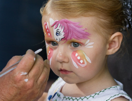 Hadlee Deines, 3, has her face painted at the 8th Annual Miracle Picnic at the Sloan Museum. She was treated for leukemia at Hurley Children's Hospital.
