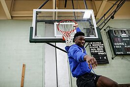 Detroit Pistons Hamidou Diallo dunks while playing one-on-one with kids attending the 'Hami Day' basketball camp at Flint Northwestern High School.