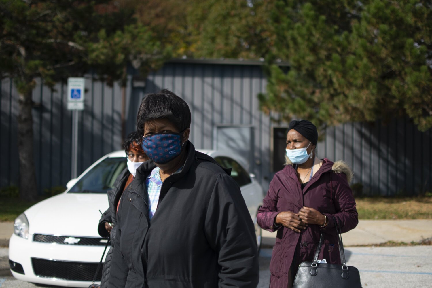 Birtie Forster (left), Lily Holbrook (center) and Louise Sampson (right) walk out of Hasselbring Senior Center after spending part of the morning together socializing.