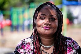 Honny Williams poses for a portrait while sitting in Sarvis Park in Flint on July 26, 2022.  (Jenifer Veloso | Flintside.com)