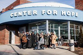 Hamilton Community Health Network and Center for Hope staff members pose for a group picture during the community-wide blanket donation delivery on Wednesday, Dec. 20, 2023. 