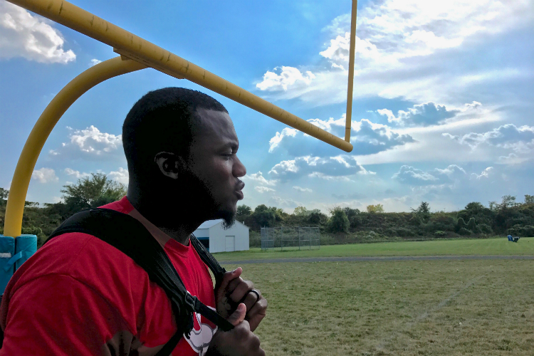 Flint schools head football coach Chris Wilson played in the NFL before returning to his hometown to coach.