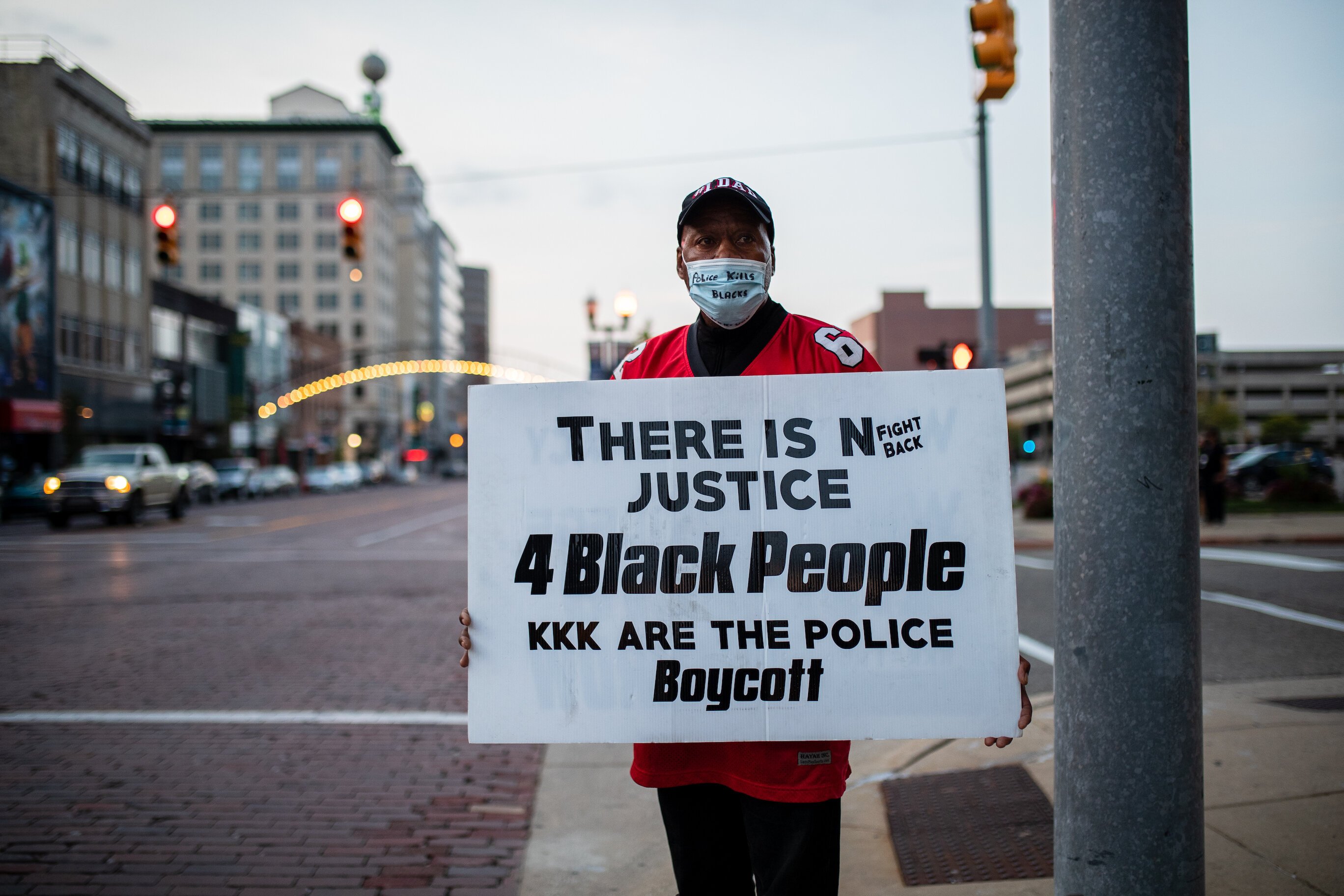 Hubert Roberts, 64, a Flint resident, stands on the corner of First and Saginaw streets in protest to the ruling in Breonna Taylor’s case. 