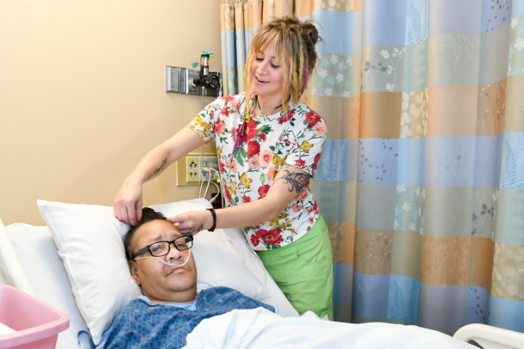 Sammi Nottingham of the Mobile Hair Care Unit gives Hurley patient Brenda Southward a trim. A grant will pay for more than 200 senior cuts.