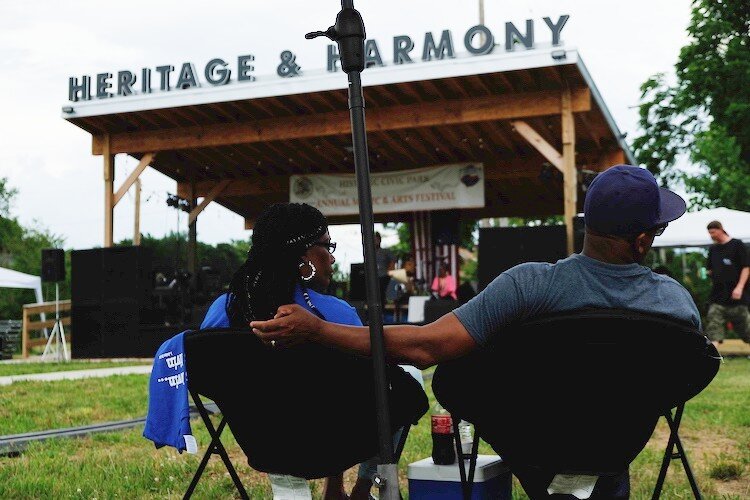 A couple watches a performance during the Heritage and Harmony festival.