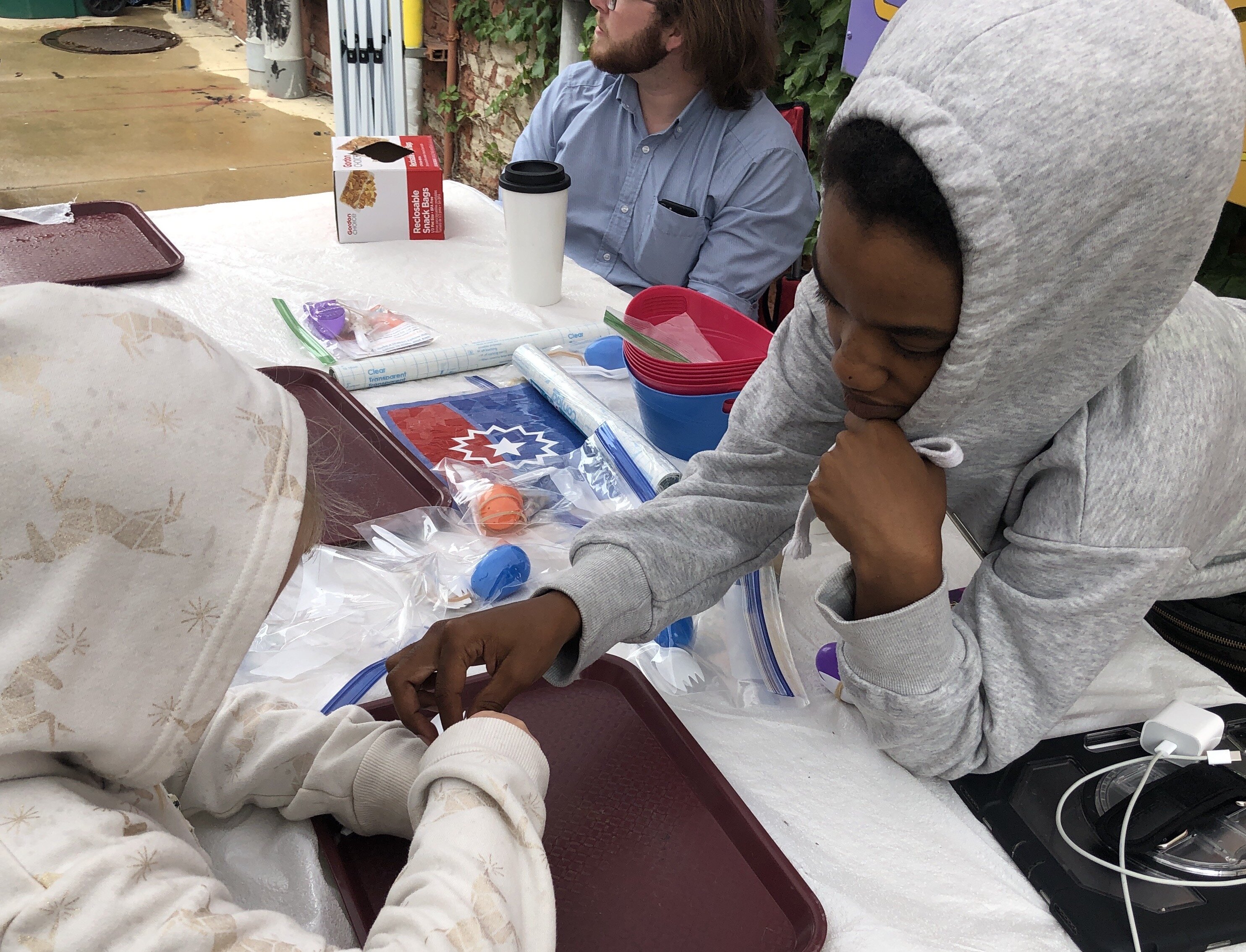 Sloan Museum provided staff members to do activities with kids in Buckham Alley on Juneteenth.