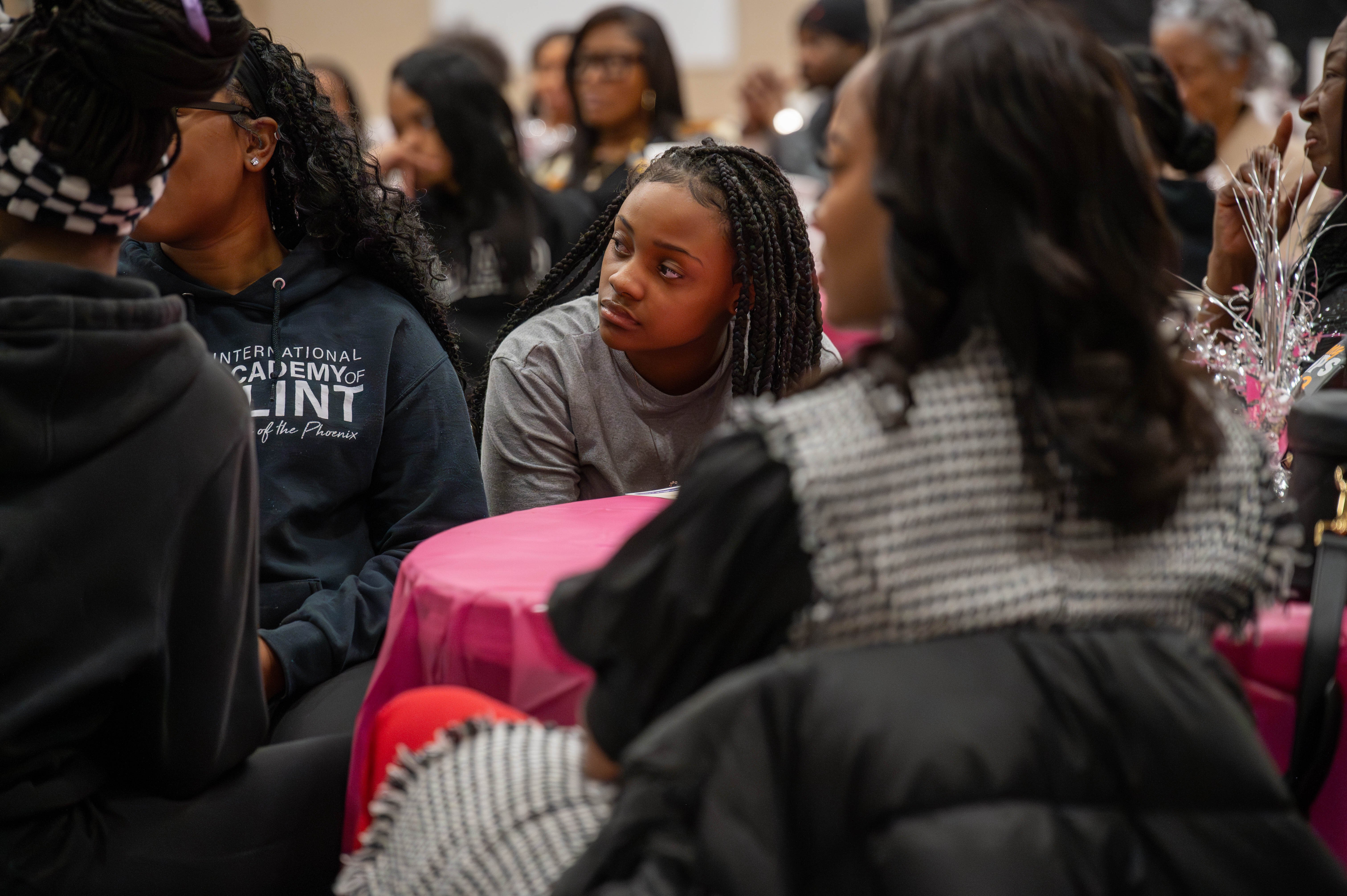 International Academy of Flint student-athletes listen to the speaker panel at the National Girls and Women’s in Sports Day event. 