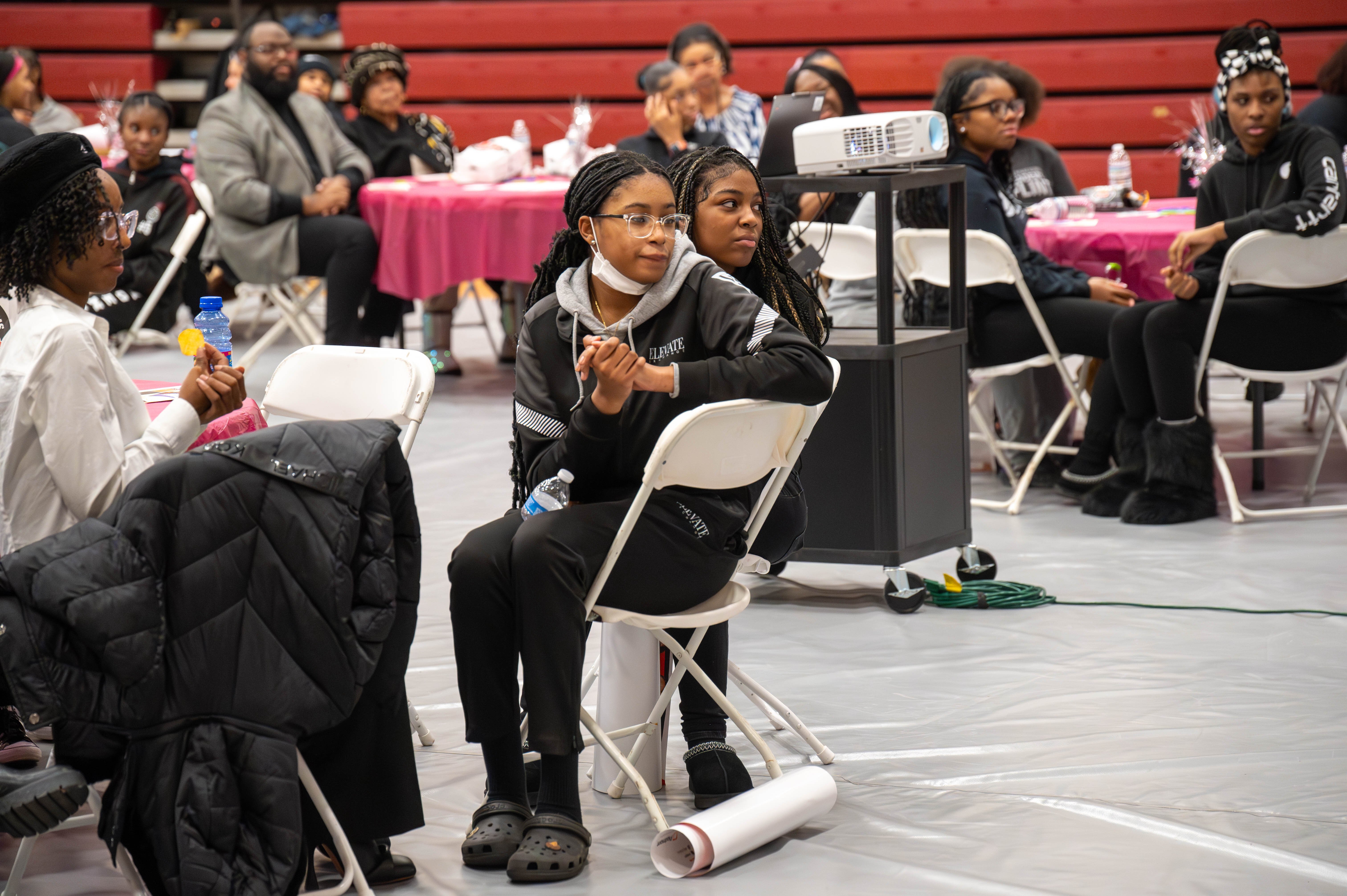 International Academy of Flint student-athletes listen to the speaker panel at the National Girls and Women’s in Sports Day event. 