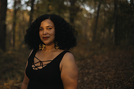 Flint native Sancia Tutt, known creatively and business-wise as Isis Ma’at, stands confident in her journey at For-Mar Nature Preserve on Tuesday, Oct. 24, 2023.