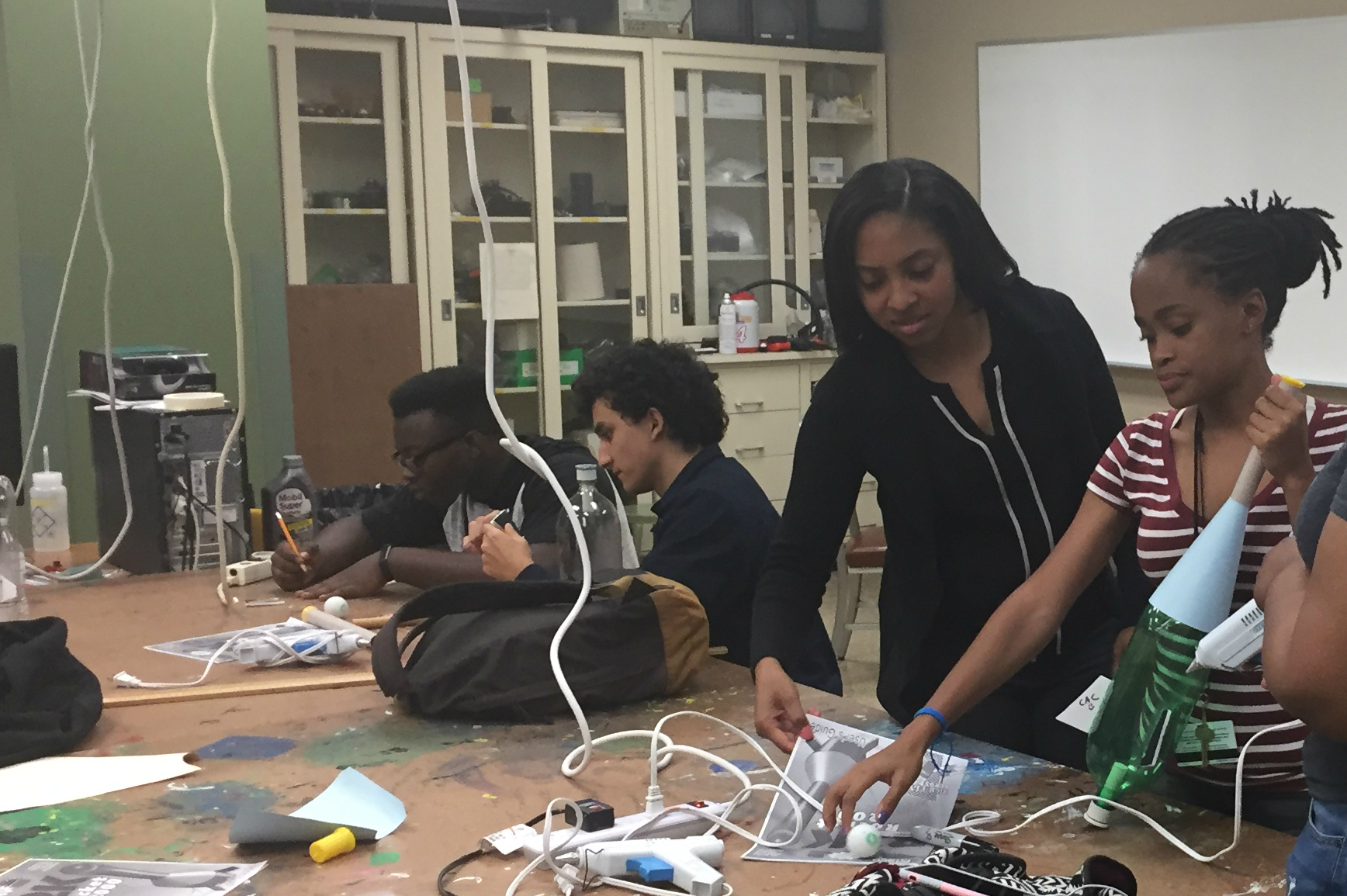 Chelsea Reeves (center, standing) now serves as a mentor in the same Kettering University summer program that encouraged her to become an engineer.