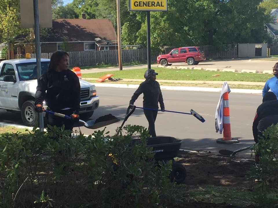 Volunteers work during a cleanup in the College Cultural Neighorhood over the summer.