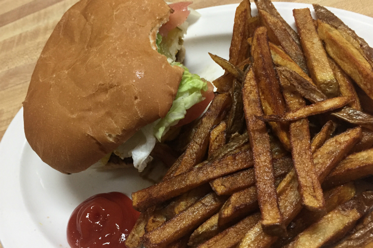 About half the customers at Krystal Jo's are in search of breakfast, no matter the time. The other half go for classics including an Olive Burger, here with pepper jack cheese.