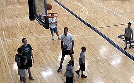 Kyle Kuzma working with young basketball players during his 2019 camp at Powers Catholic High School.