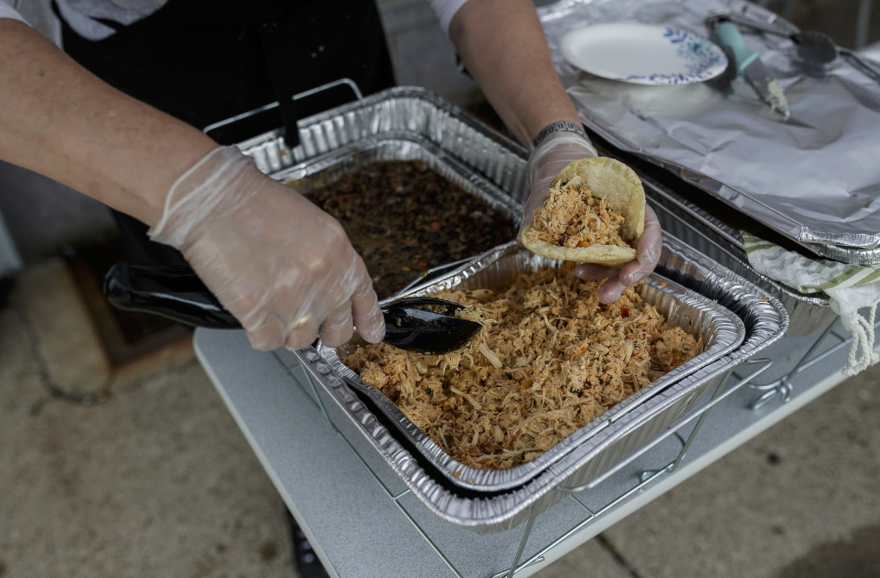 A volunteer prepares arepa.