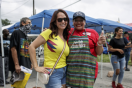 Sheyla McLain (right) poses for a photo with a Colombian friend at the 20th anniversary of the Latinx Technology Center.