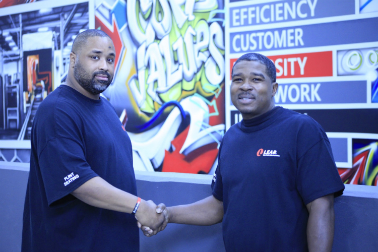 Cameron Jackson (left) and Ronnie Thompson are both from Flint and were among the first hires at the new Flint Lear plant.