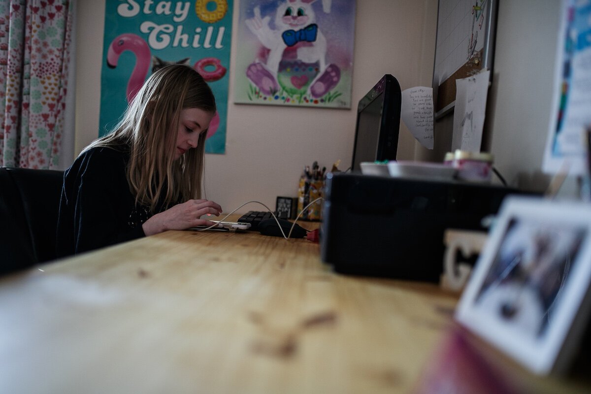 Lily Parks works at her desk.