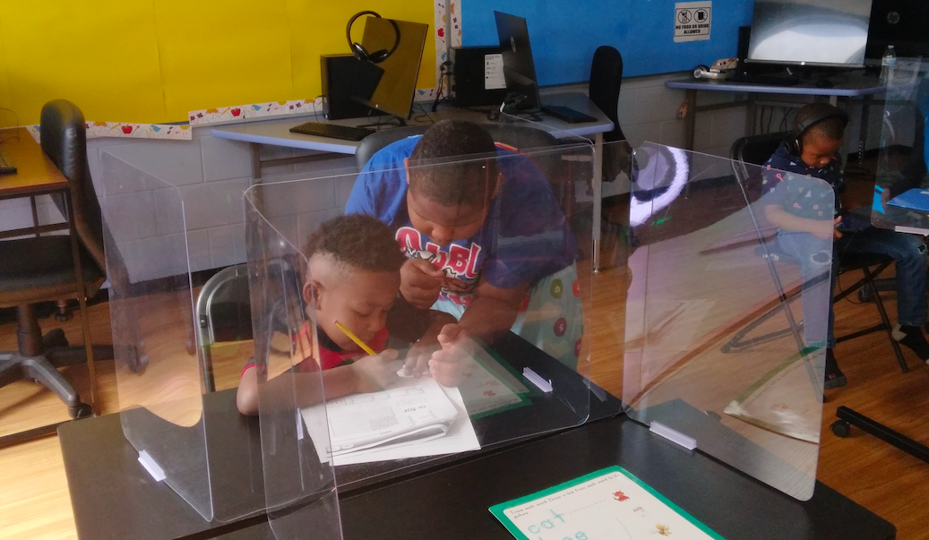 Students work on an assignment together during a Math4Flint class at the Flint Development Center located at 4121 Martin Luther King Avenue in Flint, MI. 